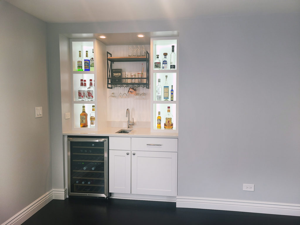 Home wet bar design with shaker white cabinets